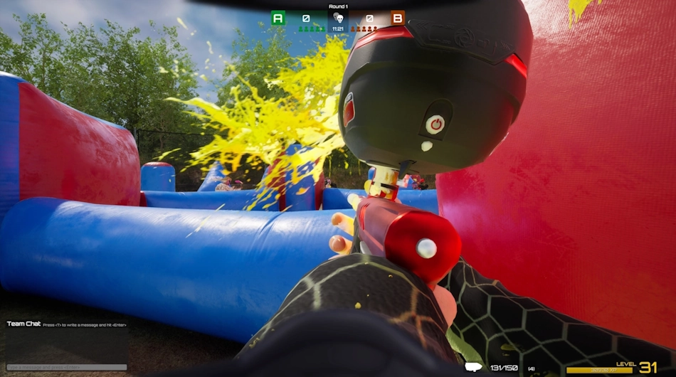Paintballs flying across the field demonstrating realistic physics in SPLASH – Paintball